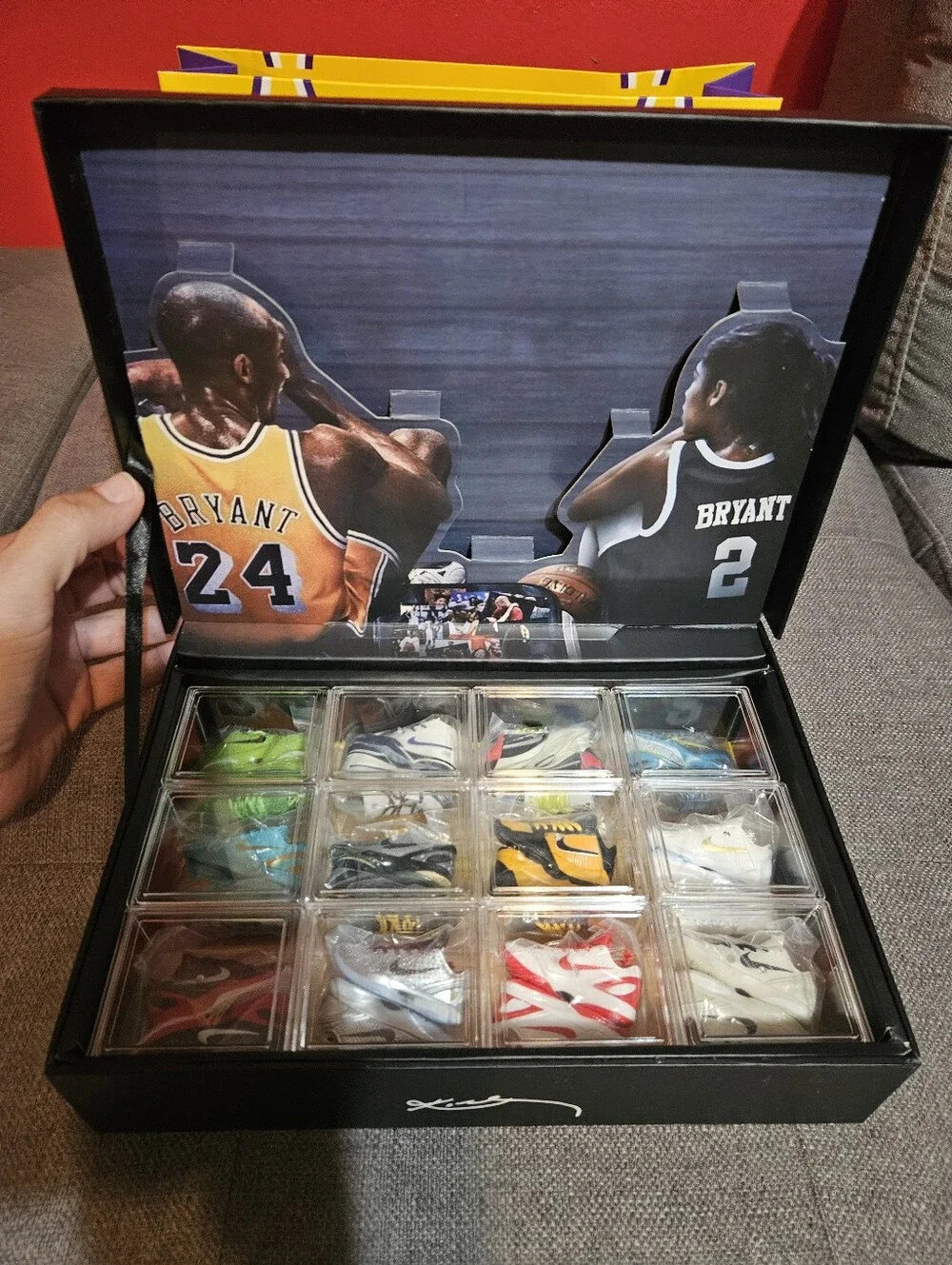 Kobe Black Mamba storage case with 12 mini sneakers included.
